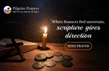 An open Bible with a few coins and a cross