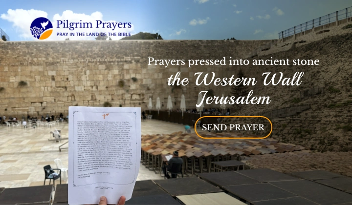 Handwritten prayer notes tucked between the ancient stones of the Western Wall in Jerusalem, representing global prayers for peace and shalom
