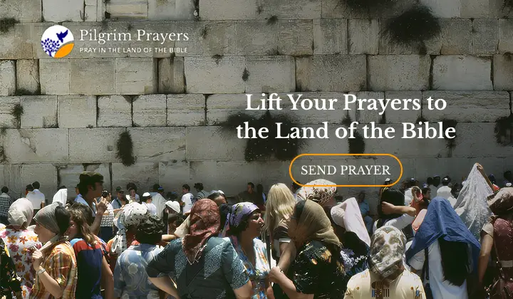 Hands lifted in prayer over Jerusalem representing believers sending prayer requests to the Land of the Bible