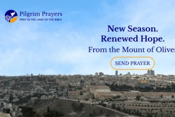 Panoramic view of the Old City of Jerusalem from the Mount of Olives, showing a large cemetery in the foreground and the Dome of the Rock.