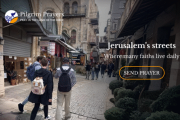 People walking through a busy street in Jerusalem’s Old City, with stone buildings, small shops, and cafés reflecting daily life returning after conflict.