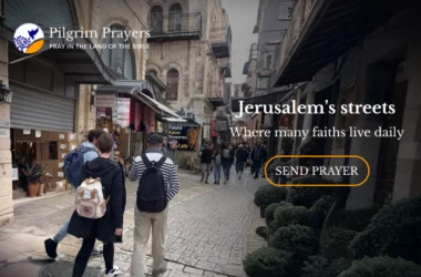 People walking through a busy street in Jerusalem’s Old City, with stone buildings, small shops, and cafés reflecting daily life returning after conflict.