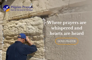 Uri praying at the stones of the Western Wall in Jerusalem, a sacred place of prayer for Jews and Christians