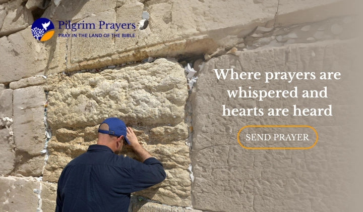 Uri praying at the stones of the Western Wall in Jerusalem, a sacred place of prayer for Jews and Christians