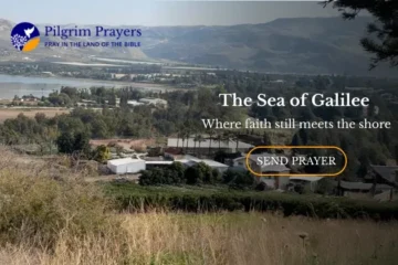 Golden sunset over the Sea of Galilee with calm water and surrounding hills in northern Israel.