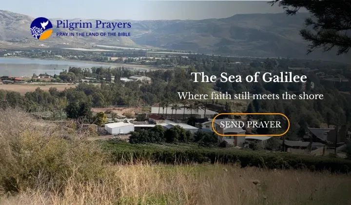 Golden sunset over the Sea of Galilee with calm water and surrounding hills in northern Israel.