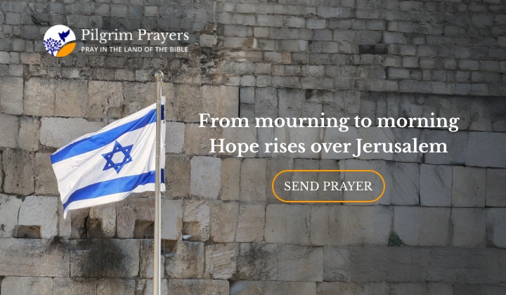Israeli flag flying beside the Western Wall in Jerusalem, symbolizing remembrance, faith, and hope