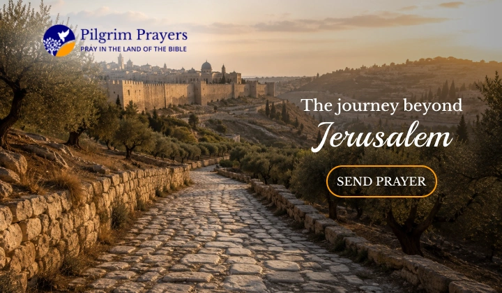 Ancient stone road leading east from Jerusalem toward the Mount of Olives and Bethany with olive trees and city walls visible in the morning light
