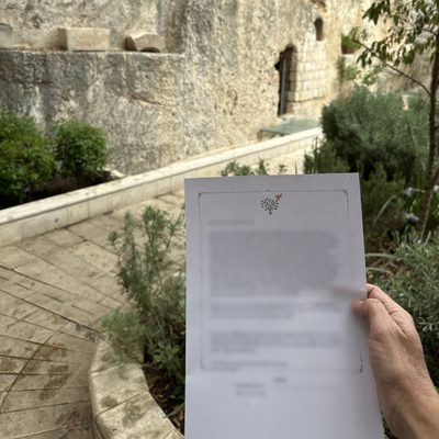 A printed prayer held before the tomb at the Garden Tomb